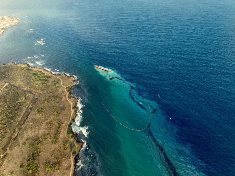 An oil spill in Tobago Island, Trinidad and Tobago, leaves black residue on beach (via REUTERS)