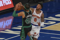 Boston Celtics guard Romeo Langford (45) drives to the basket as New York Knicks guard Elfrid Payton (6) defends during the second half of an NBA basketball game in New York, Sunday, May 16, 2021. (Vincent Carchietta/Pool Photo via AP)