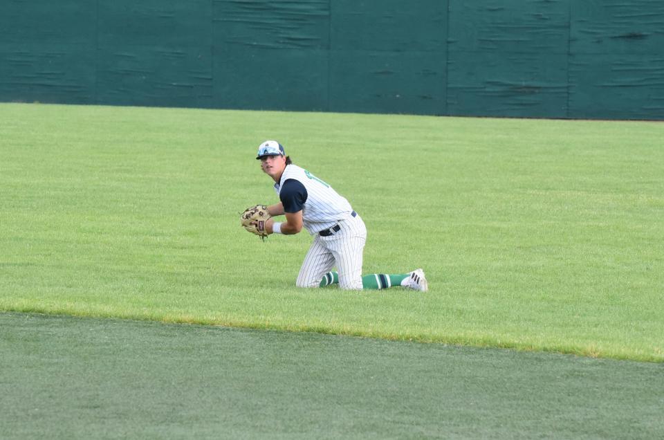 Michigan Monarchs infielder Sandyn Cuthrell gathers himself to make a throw to first for an out during Game 1 of a doubleheader Thursday against the Richmond Jazz at Siena Heights.