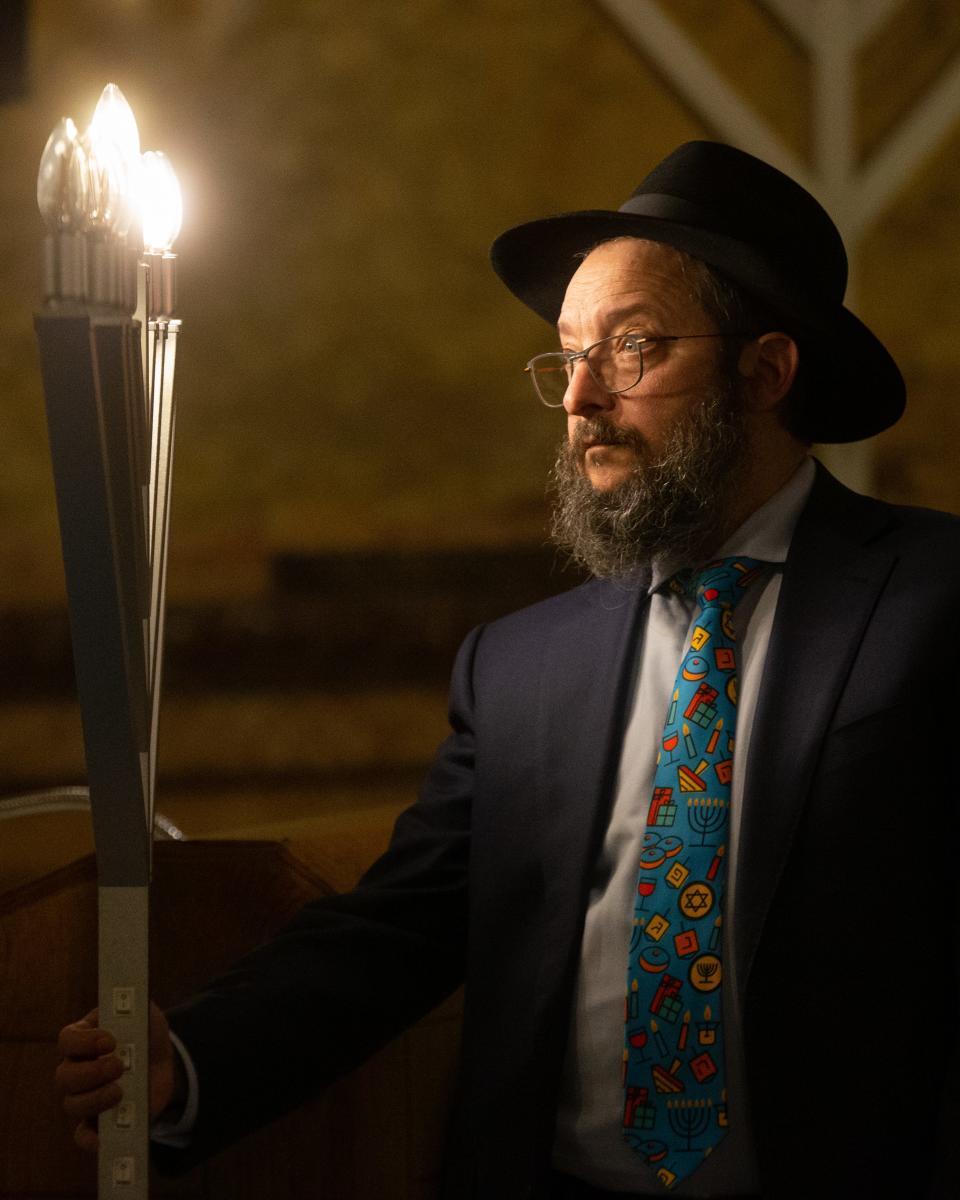 Rabbi Mendy Wineberg, from the Chabad House Center of Kansas City, tests the menorah lights in 2020.
(Credit: Evert Nelson/The Capital-Journal)