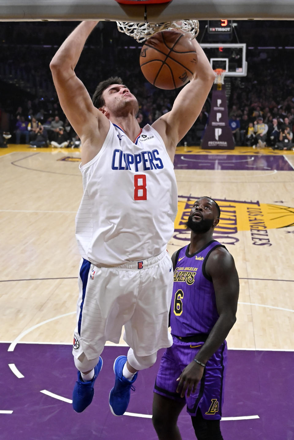 Los Angeles Clippers forward Danilo Gallinari dunks as Los Angeles Lakers guard Lance Stephenson watches during the first half of an NBA basketball game Friday, Dec. 28, 2018, in Los Angeles. (AP Photo/Mark J. Terrill)