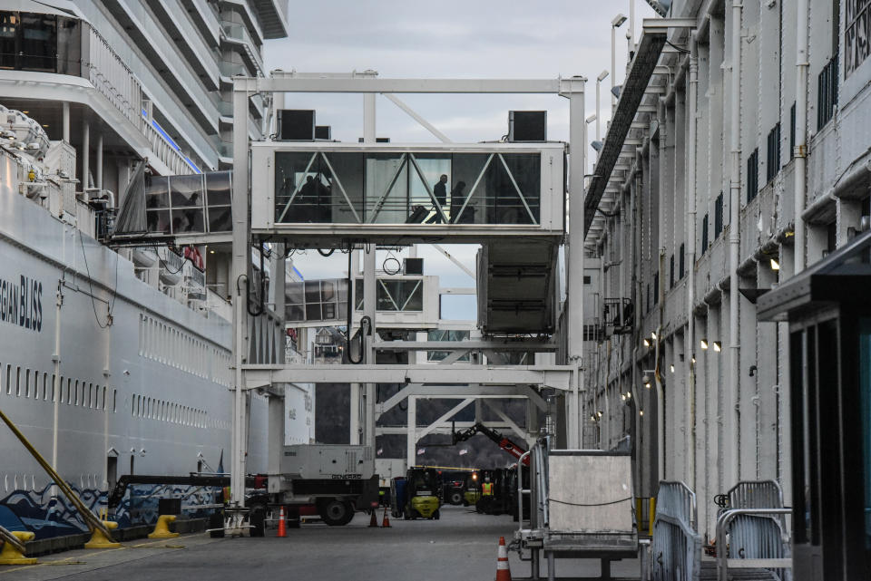 NEW YORK, NY - MARCH 15: Passengers disembark from the Norwegian Bliss cruise ship on March 15, 2020 in New York City. Mayor Bill de Blasio said on Tuesday that any cruise ship passenger disembarking in New York City with a temperature over 100.4 will be given the choice of self-isolating at home or be taken to a hospital to protect against the spread of COVID-19. (Photo by Stephanie Keith/Getty Images)