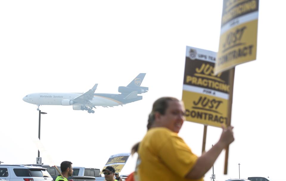 A UPS jet on approach to landing at Louisville International Airport as UPS workers began a practice strike outside Worldport, the largest sorting and logistics facility in America Wednesday morning in Louisville, Ky. The International Brotherhood of Teamsters says UPS presented "an appalling economic counterproposal" during national negotiations for a new labor contract. June 28, 2023