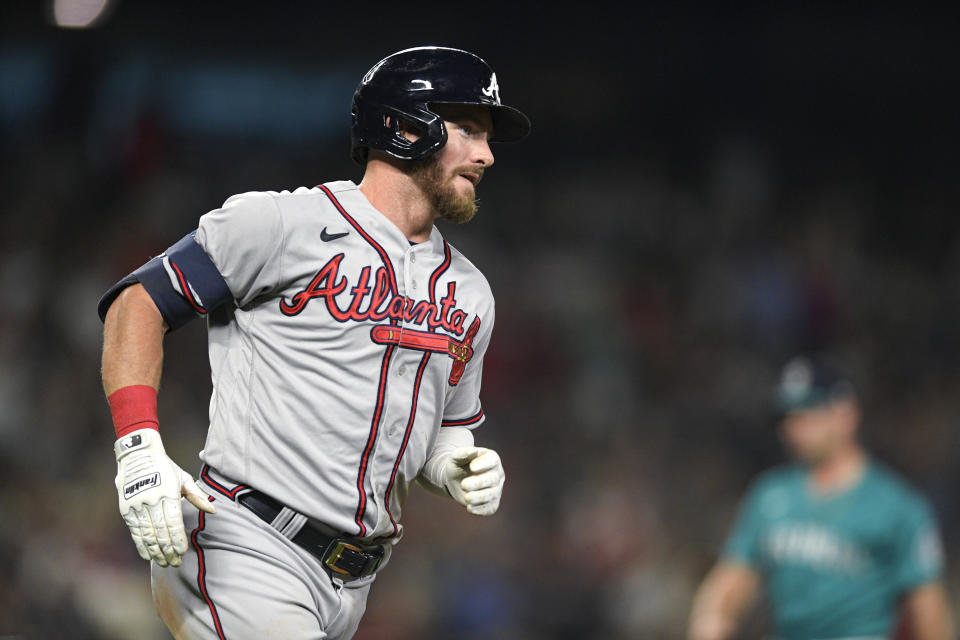 Atlanta Braves' Robbie Grossman runs the bases after hitting a solo home run against the Seattle Mariners during the sixth inning of a baseball game Friday, Sept. 9, 2022, in Seattle. (AP Photo/Caean Couto)