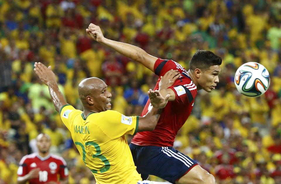 Brazil's Maicon jumps for the ball with Colombia's Teofilo Gutierrez during their 2014 World Cup quarter-finals at the Castelao arena in Fortaleza July 4, 2014. REUTERS/Stefano Rellandini