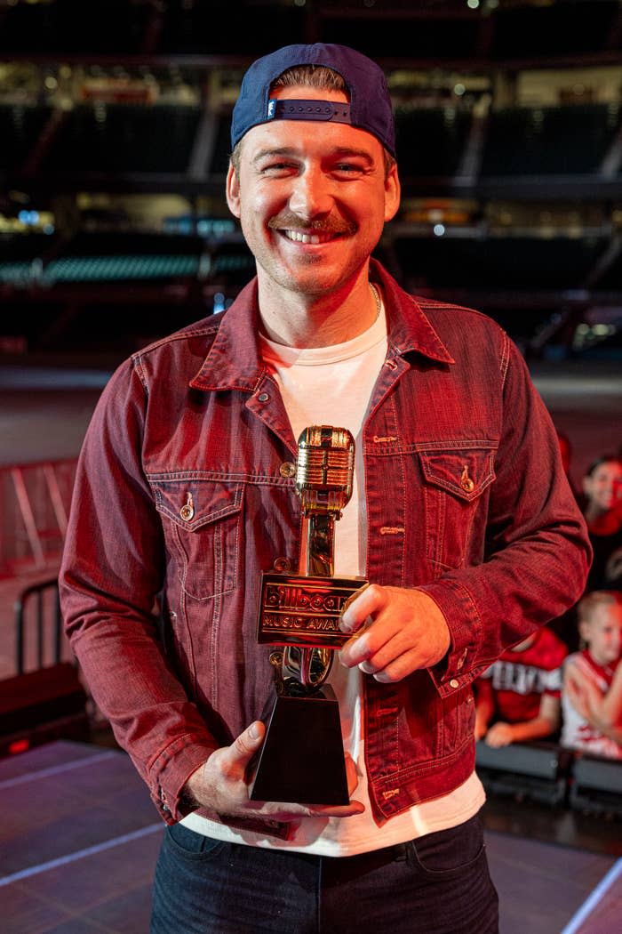 Closeup of Morgan Wallen holding an award