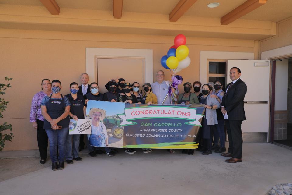 Dan Cappello (middle, holding balloons) was named 2022 Riverside County Classified Administrator of the Year in La Quinta, Calif., on Friday, March 11, 2022.