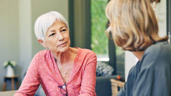 Shot of a mature woman and her elderly mother having coffee and a chat at home.