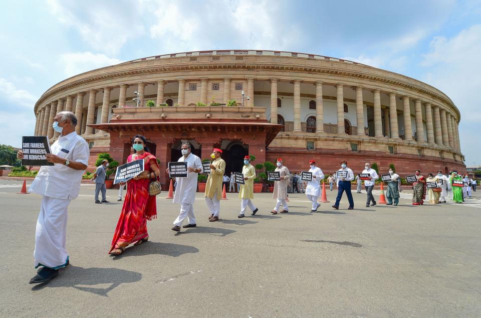 Opposition MPs march from Gandhi statue to Ambedkar statue in protest against the recent farm and labour bills, during the ongoing Monsoon Session, at Parliament House in New Delhi on 23 September 2020. 