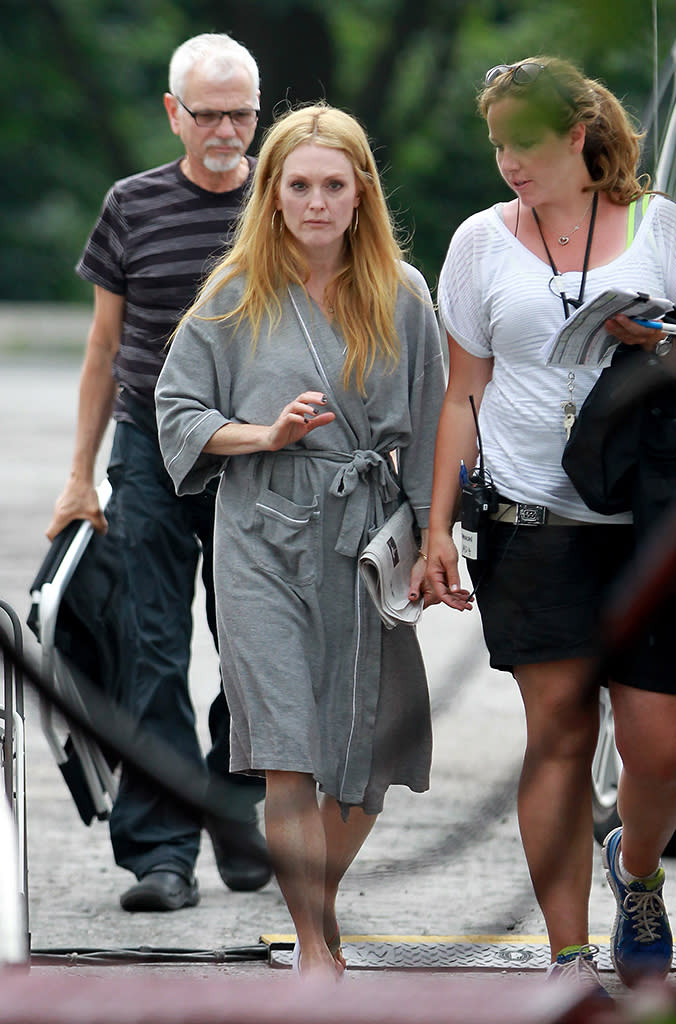 Julianne Moore wears a bathrobe en route to her trailer while filming 'Maps to the Stars' in Toronto