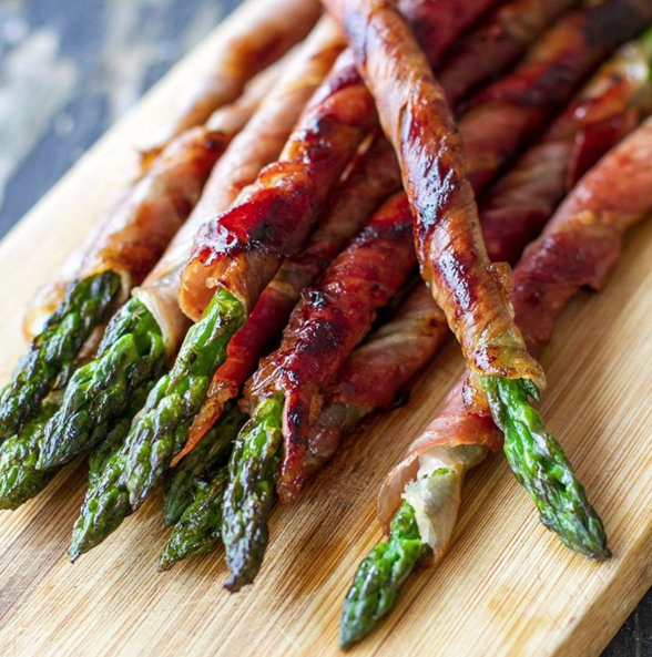 <p>Make asparagus a bit more substantial by wrapping in parma ham, and serve up with boiled or poached eggs to make a delicate, but filling dinner made in minutes. <i>[Picture: Instagram/Irena Macri]</i></p>