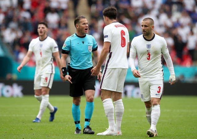 Harry Maguire talks to the referee 