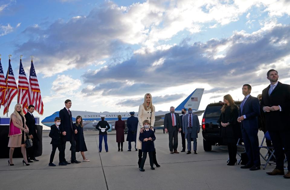Ivanka Trump (C), husband Jared Kushner (C-L), their children, Eric (R) and Donald Jr. (2nd R), Tiffany Trump (L) and Trump family members stand on the tarmac at Joint Base Andrews in Maryland as they arrive for US President Donald Trump's departure on January 20, 2021. - President Trump travels to his Mar-a-Lago golf club residence in Palm Beach, Florida, and will not attend the inauguration for President-elect Joe Biden. (Photo by ALEX EDELMAN / AFP) (Photo by ALEX EDELMAN/AFP via Getty Images)