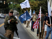 <p><span>White supremacists pass a militia member as the they arrive for a rally in Charlottesville, Virginia, U.S., August 12, 2017. (Photo: Joshua Roberts/Reuters)</span> </p>