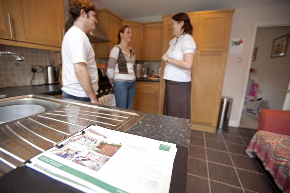 Illustrative image of a young couple being shown around a house by an Estate Agent. (Photo by: Newscast/Universal Images Group via Getty Images)