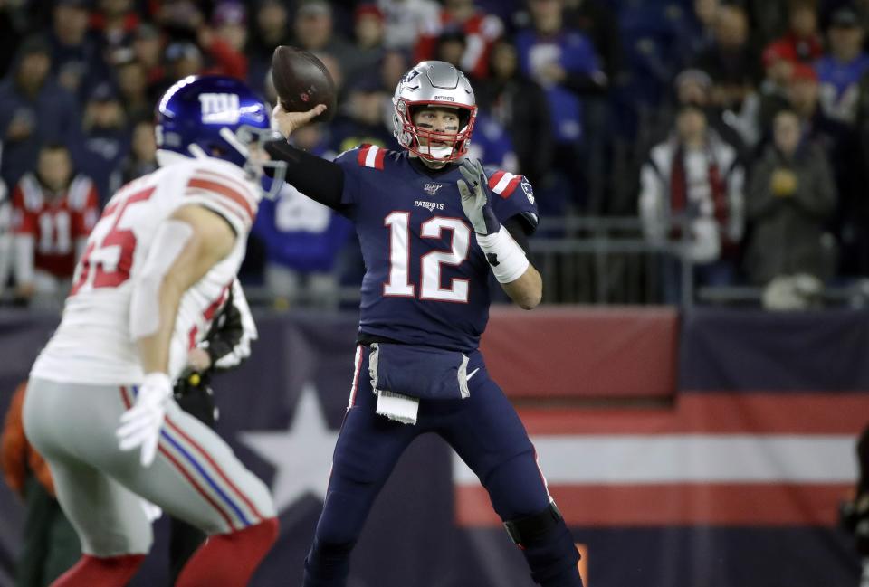 New England Patriots quarterback Tom Brady throws his first pass of the game against the New York Giants in the first half of an NFL football game, Thursday, Oct. 10, 2019, in Foxborough, Mass. The completion gave Brady the second most total passing yards in NFL history. (AP Photo/Elise Amendola)