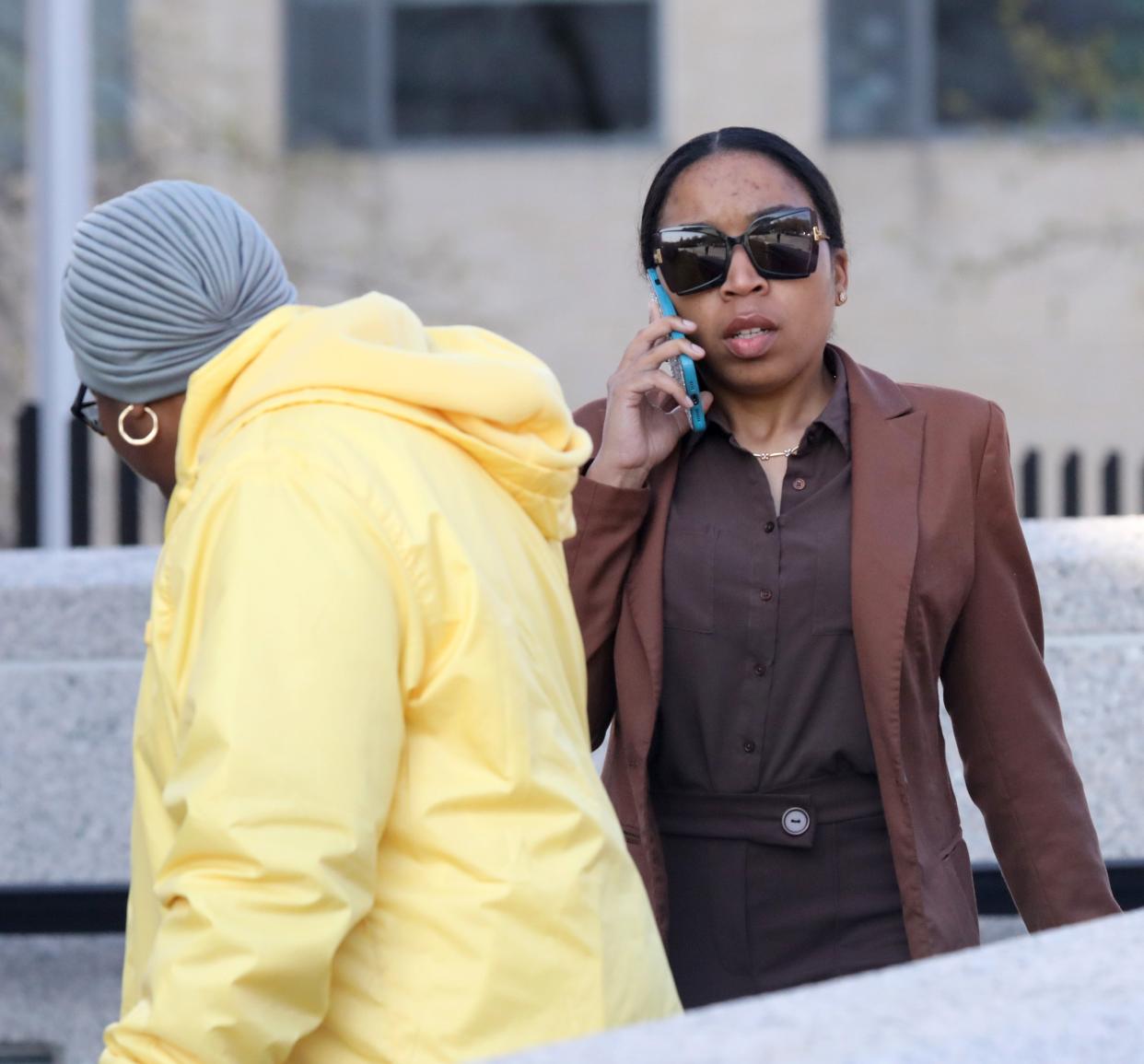 Alicia Ayers of Mount Vernon, right, walks out of the federal courthouse in White Plains April 26, 2024, after being sentenced in a pandemic relief fraud case.