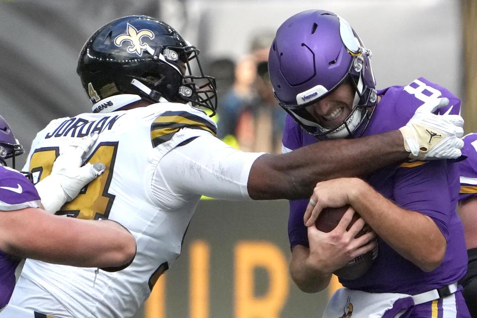 Oct 2, 2022; London, United Kingdom; Minnesota Vikings quarterback Kirk Cousins (8) is pressured by New Orleans Saints defensive end Cameron Jordan (94) in the first half during an NFL International Series game at Tottenham Hotspur Stadium. The Vikings defeated the Saints 28-25. Mandatory Credit: Kirby Lee-USA TODAY Sports