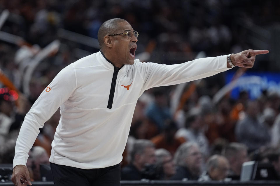 Texas head coach Rodney Terry signals to his players during the first half of an NCAA college basketball game West Virginia in Austin, Texas, Saturday, Feb. 11, 2023. (AP Photo/Eric Gay)