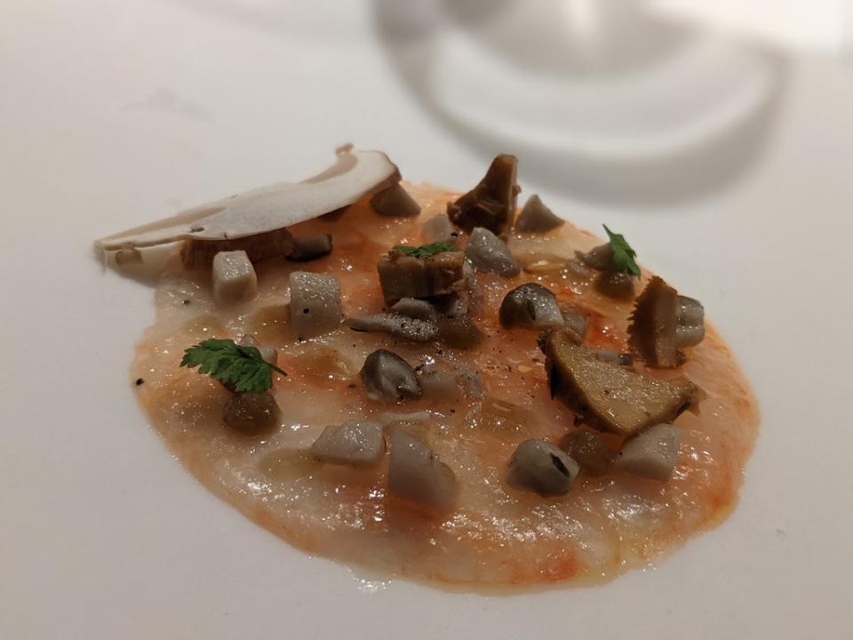 A carpaccio of lobster dotted with fresh mushrooms, one of the stand-out dishes in the degustation menu at Els Tinars (credit: Jonjo Maudsley/PA).