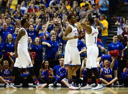 Kansas Jayhawks guard Andrew Wiggins (22) is congratulated by Wayne Selden, Jr. (1) against the Eastern Kentucky Colonels in the second half during the 2nd round of the 2014 NCAA Men's Basketball Championship at Scottrade Center. Mar 21, 2014; St. Louis, MO, USA; Jasen Vinlove-USA TODAY Sports -