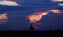 Saint Peter's square is silhouetted during a sunset in Rome September 25, 2014. REUTERS/Tony Gentile