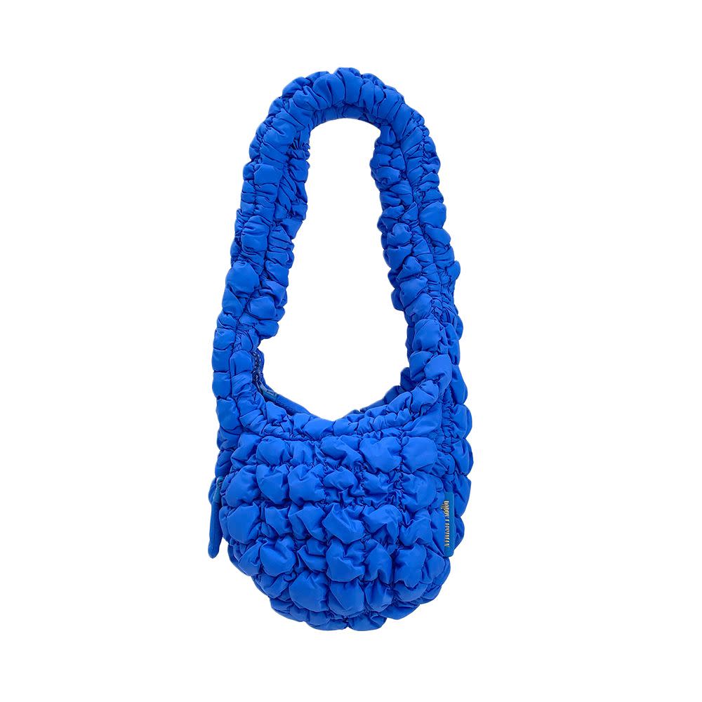 <p><a href="https://go.redirectingat.com?id=74968X1596630&url=https%3A%2F%2Fus.poppylissiman.com%2Fproducts%2Fpuff-pouch-blue%3Fgclid%3DCj0KCQjw5f2lBhCkARIsAHeTvlgJmf8wufYX3k47usrUMbIi9u4xBkj-3DW7sUUtIXr2glHiQqQtxdYaAr0hEALw_wcB&sref=https%3A%2F%2Fwww.elle.com%2Ffashion%2Fshopping%2Fg44640132%2Fbest-quilted-tote-bags%2F" rel="nofollow noopener" target="_blank" data-ylk="slk:Shop Now;elm:context_link;itc:0;sec:content-canvas" class="link rapid-noclick-resp">Shop Now</a></p><p>Puff Bag</p><p>$95.00</p><p>poppylissiman.com</p><span class="copyright">Courtesy</span>