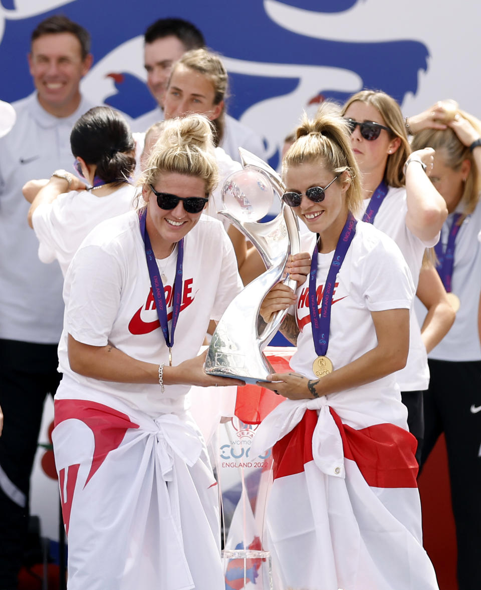 England players Millie Bright and Rachel Daly with the trophy during a fan celebration to commemorate England's historic UEFA Women's EURO 2022 triumph in Trafalgar Square, London. Picture date: Monday August 1, 2022.