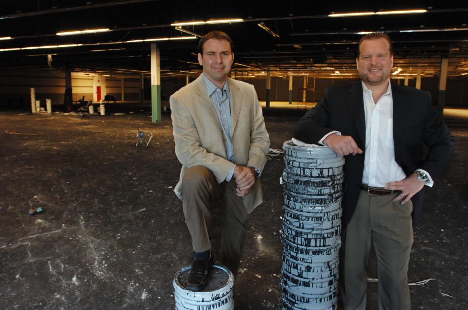 Latitude 360 Managing Partner Brent Brown (right) with then-partner Damon Brush as they announced plans in 2009 to open the entertainment center.