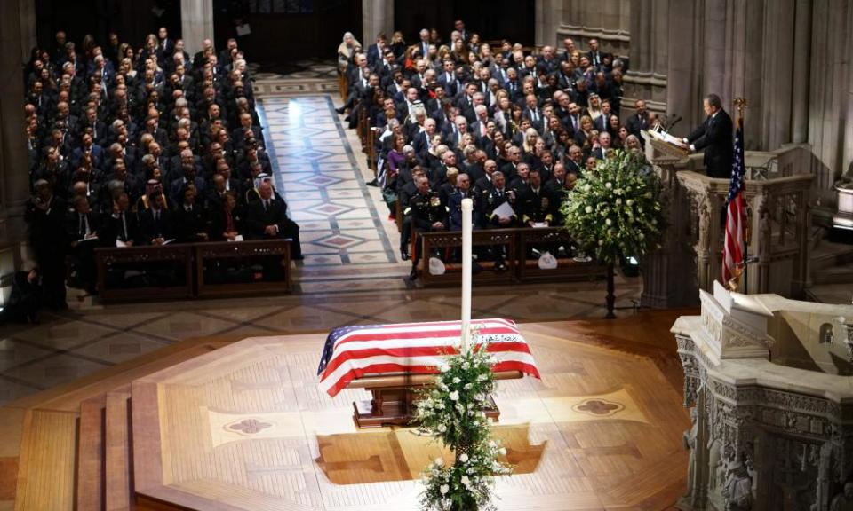 Former president George W Bush delivers his eulogy during a funeral service at the National Cathedral in Washington DC on Wednesday.
