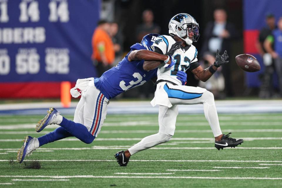 Aug 18, 2023; East Rutherford, New Jersey, USA; New York Giants safety Gervarrius Owens (31) breaks up a pass intended for Carolina Panthers wide receiver Shi Smith (12) during the first half at MetLife Stadium. Mandatory Credit: Vincent Carchietta-USA TODAY Sports