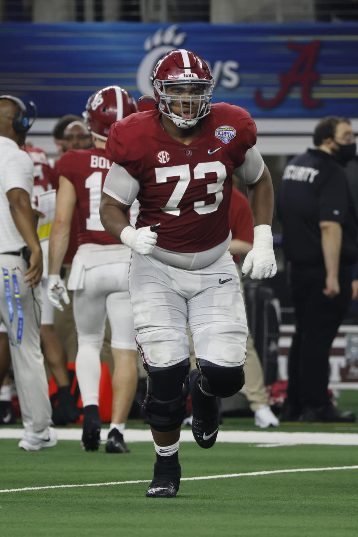 Alabama offensive lineman Evan Neal (73) jogs onto the field during the Cotton Bowl NCAA College Football Playoff semifinal game, Friday, Dec. 31, 2021, in Arlington, Texas. (AP Photo/Michael Ainsworth)
