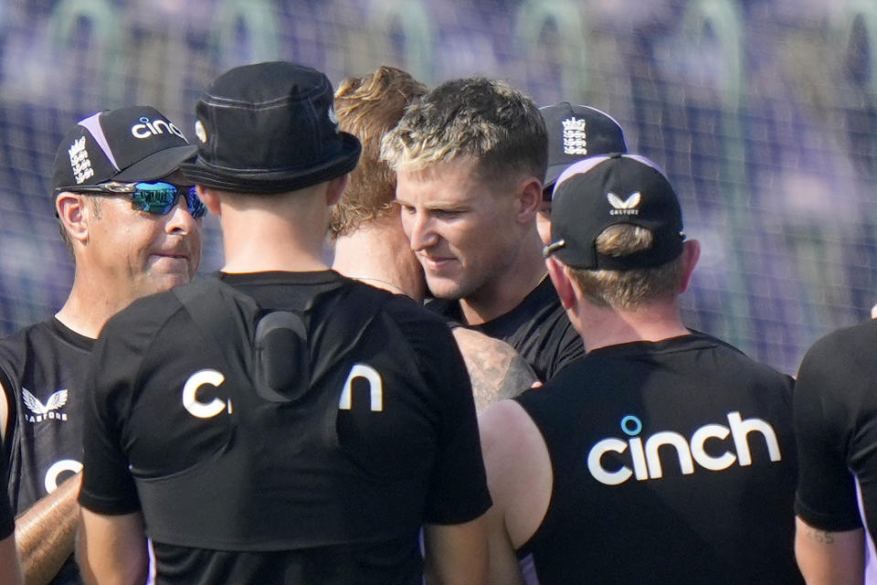 England's Brydon Carse, center, hugs with Ben Stokes after receiving test debut before the start of the play of first test cricket match between Pakistan and England, in Multan, Pakistan, Monday, Oct. 7, 2024. (AP Photo/Anjum Naveed)