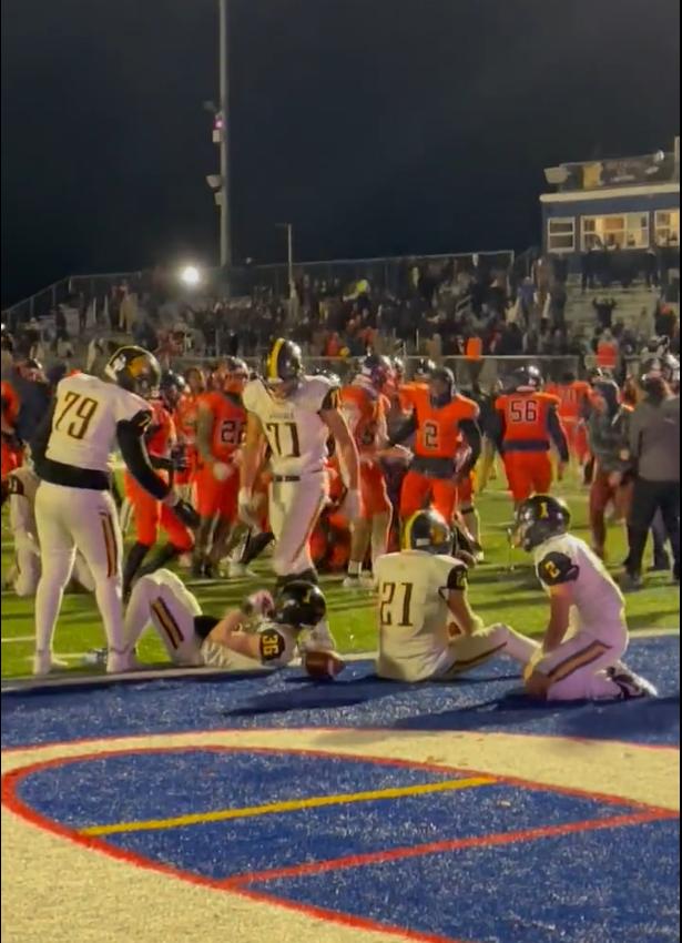 McQuaid players collect themselves in the end zone after Bennett's game-winning touchdown on the final play of the state quarterfinals.