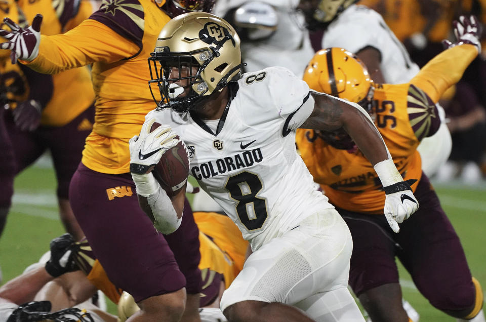 FILE - Colorado tailback Alex Fontenot (8) finds running room against the Arizona State defense during the second half of an NCAA college football game Sept. 25, 2021, in Tempe, Ariz. Fontenot, the team’s leading ground gainer in 2019, figures to split the duties with Deion Smith. (AP Photo/Darryl Webb, File)