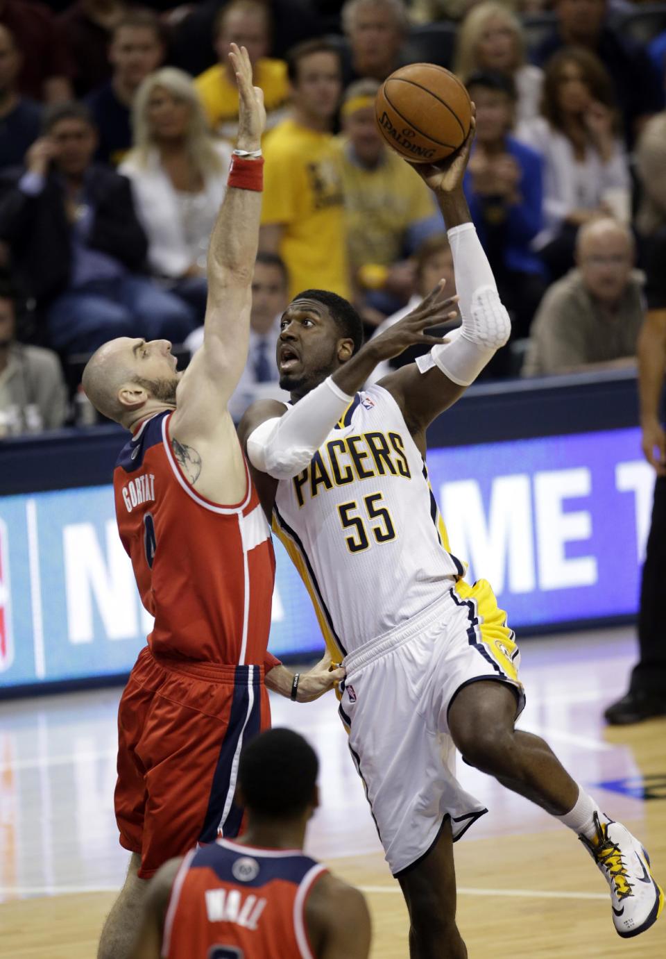 Indiana Pacers center Roy Hibbert (55) shoots over Washington Wizards center Marcin Gortat during the first half of game 5 of the Eastern Conference semifinal NBA basketball playoff series Tuesday, May 13, 2014, in Indianapolis. (AP Photo/AJ Mast)