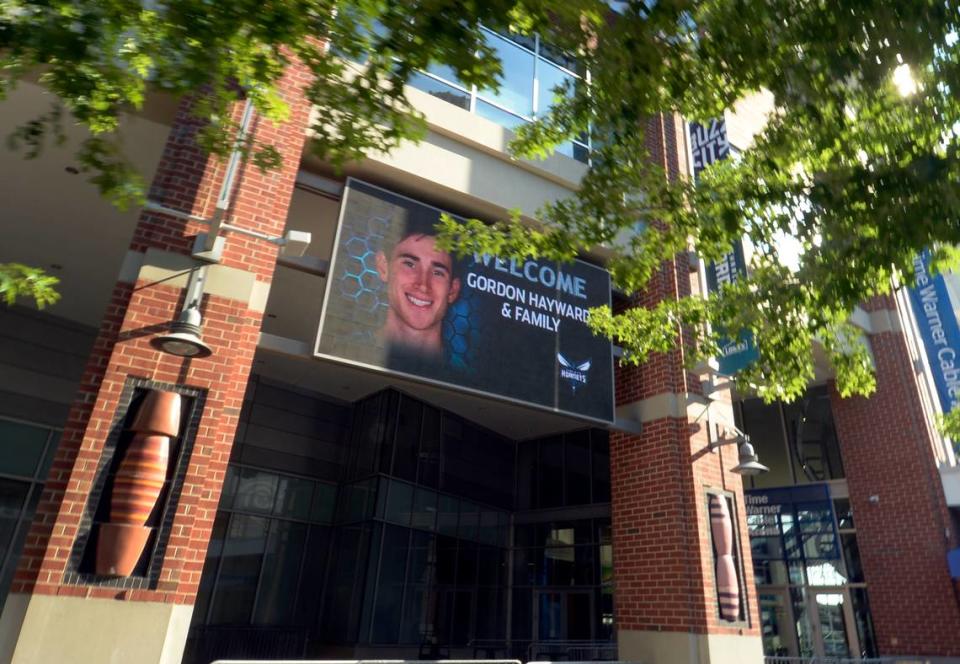 In this 2014 file photo, an illuminated marquee at Time Warner Cable Arena (now Spectrum Center) welcomed Gordon Hayward to the Charlotte Hornets.