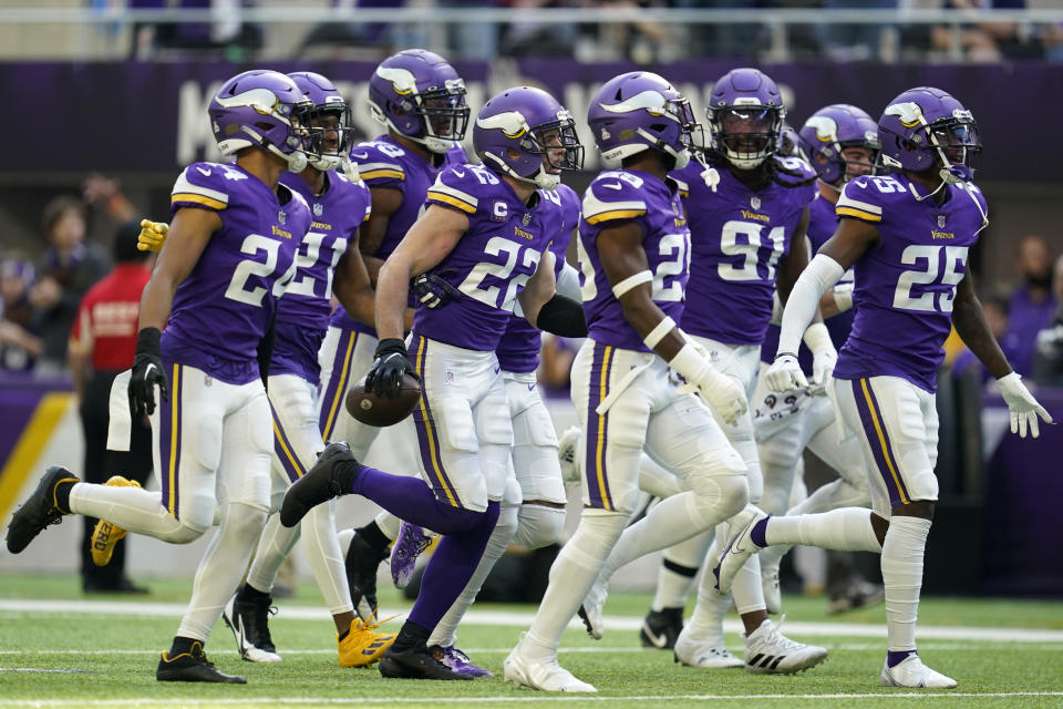 Minnesota Vikings safety Harrison Smith (22) celebrates with teammates after intercepting a pass during the second half of an NFL football game against the Arizona Cardinals, Sunday, Oct. 30, 2022, in Minneapolis. (AP Photo/Abbie Parr)