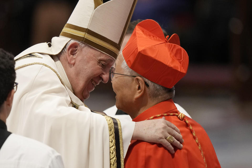 New Cardinal Lazzaro You Heung-Sik receives the red three-cornered biretta hat from Pope Francis during a consistory inside St. Peter's Basilica, at the Vatican, Saturday, Aug. 27, 2022. Pope Francis has chosen 20 men to become the Catholic Church's newest cardinals. (AP Photo/Andrew Medichini)