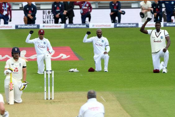 Shane Dowrich, Jermaine Blackwood and Jason Holder of the West Indies take a knee along with England's Rory Burns (Getty)