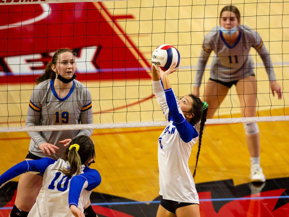 Lutheran's Caleina Herman (8) sets the ball for the Crusaders against Augusta Southeastern during the semifinals of the IHSA Class 1A State Final Tournament at Redbird Arena in Normal, Ill., Friday, November 12, 2021. [Justin L. Fowler/The State Journal-Register] 