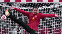 <p>Sweden's goalkeeper Andreas Palicka tries to make a save during the men's Preliminary Round Group B handball match between Sweden and Portugal at the 2020 Summer Olympics, Wednesday, July 28, 2021, in Tokyo, Japan. (AP Photo/Pavel Golovkin)</p> 