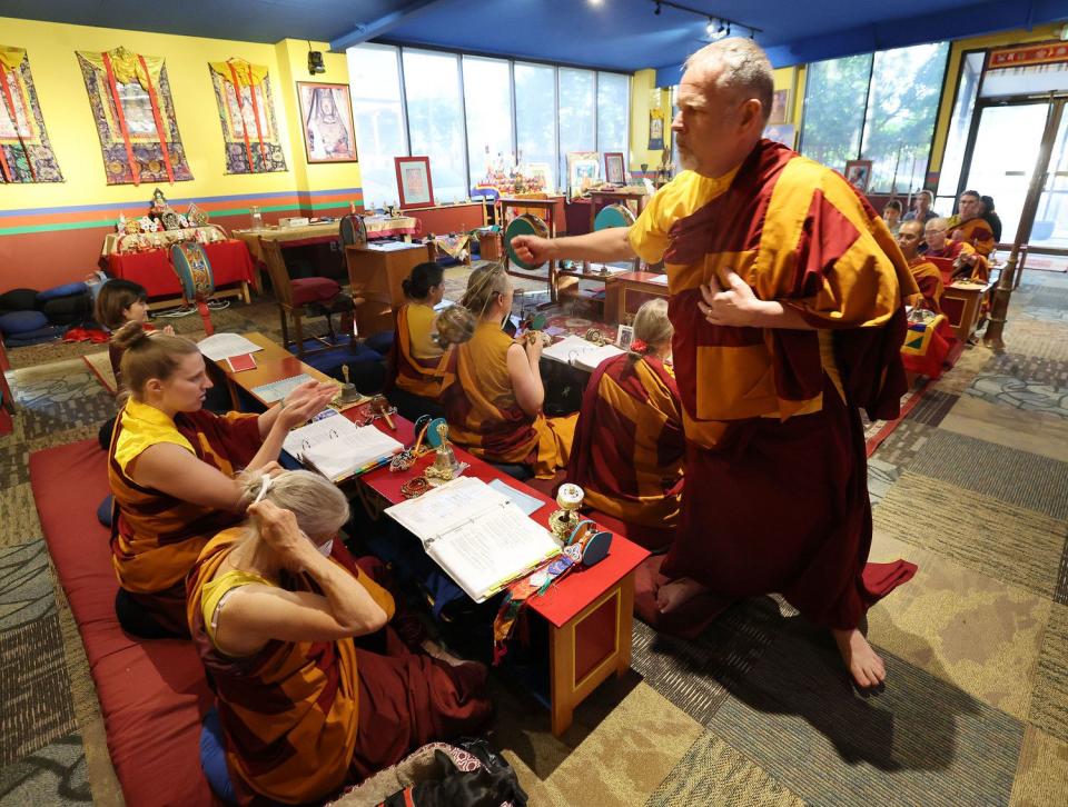 Konchok Jinpa and practitioners at the Urgyen Samten Ling Tibetan Buddhist Temple participate in Prayers for Compassion in Salt Lake City on Thursday.
