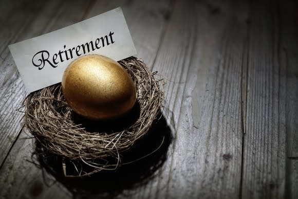 Golden egg in nest with retirement placard