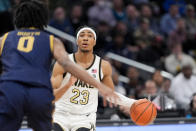 Wake Forest guard Hunter Sallis (23) looks as he dribbles with Notre Dame forward Carey Booth (0) nearby during the first half of an NCAA college basketball game in the second round of the Atlantic Coast Conference tournament, Wednesday, March 13, 2024, in Washington. (AP Photo/Susan Walsh)