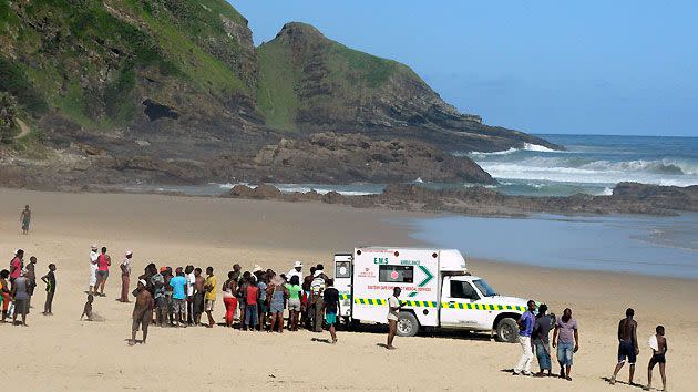 Locals watch on as paramedics work on Mr Msungubana.