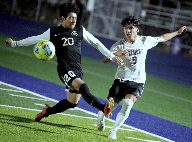 Fremont winger Joshua Valenzuela crosses the ball into the penalty area in front of Marquez defender Henry Gonzalez