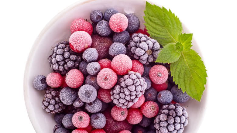 bowl of frozen fruit with mint