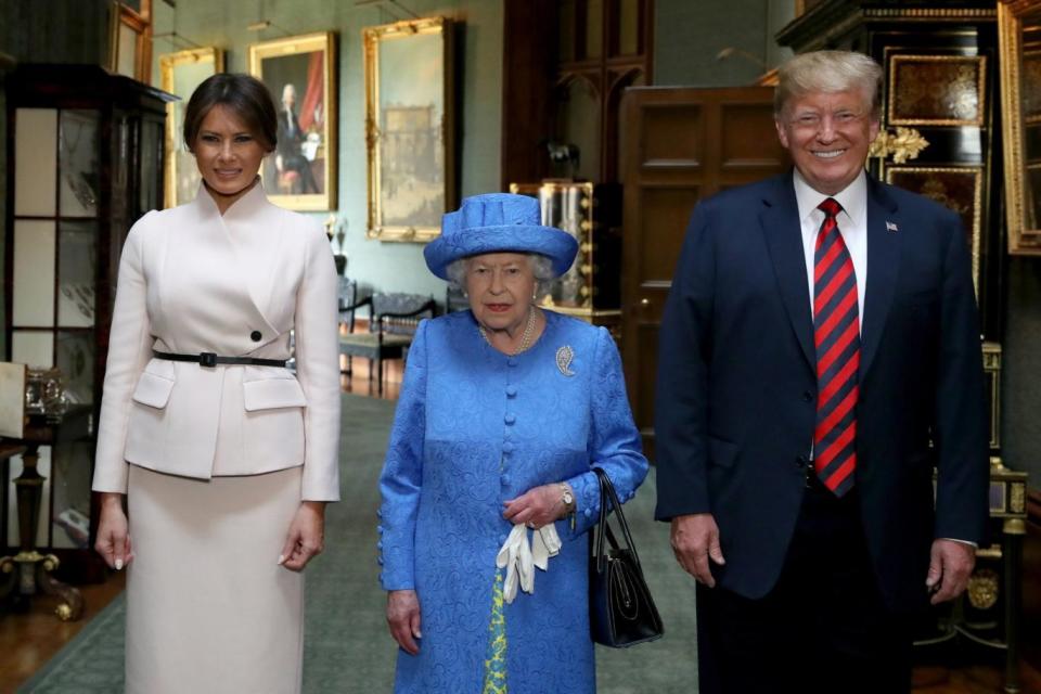 Queen Elizabeth II stands with US President Donald Trump and his wife, Melania (PA)