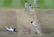 West Indies cricketer Carlton Baugh (L) gets run out during the second day of the first-of-three Test matches between Australia and West Indies at the Kensington Oval stadium in Bridgetown on April 8, 2012. AFP PHOTO/Jewel Samad (Photo credit should read JEWEL SAMAD/AFP/Getty Images)